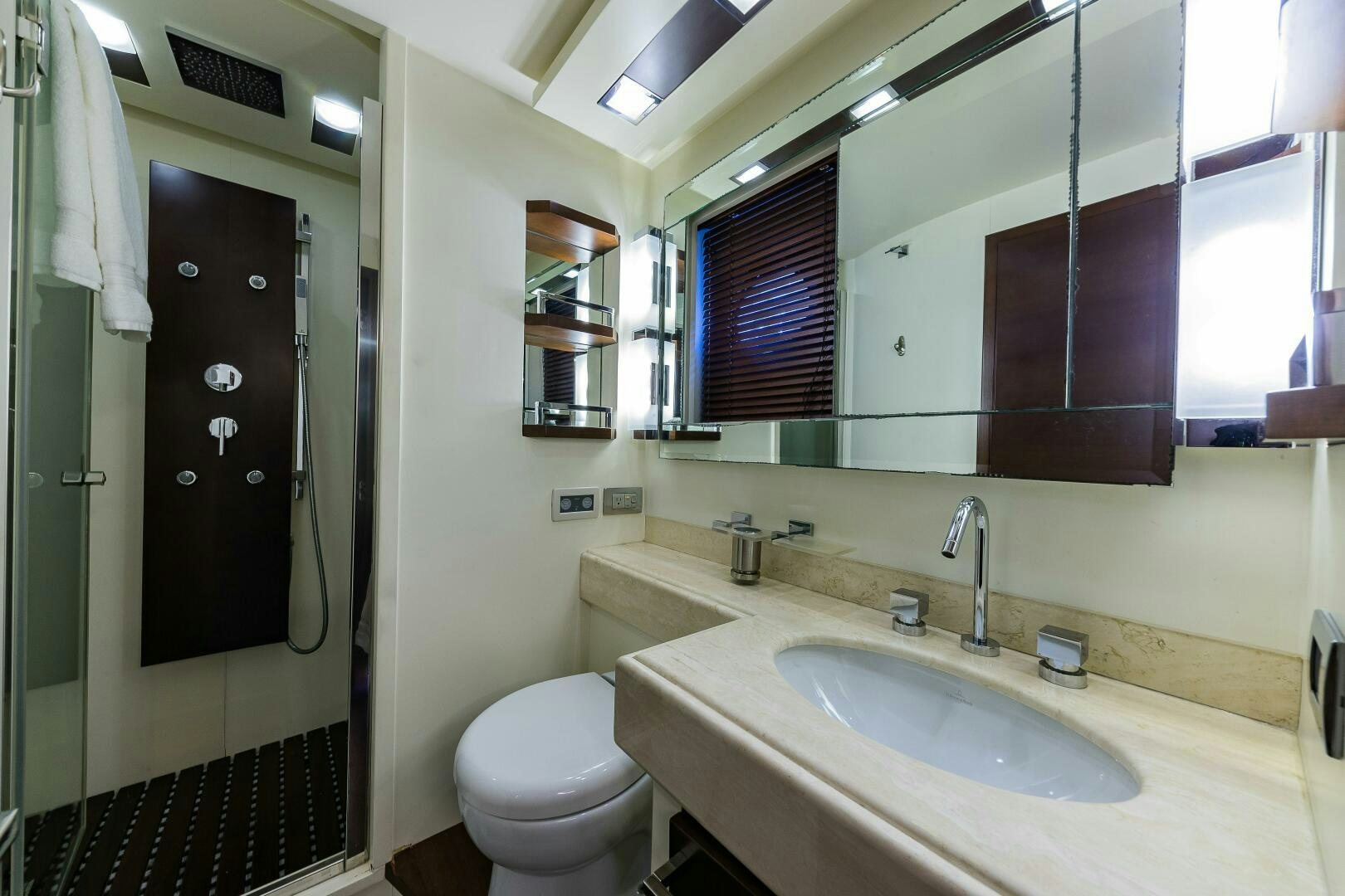 a bathroom with a sink and toilet aboard MINIMAL RISK Yacht for Sale