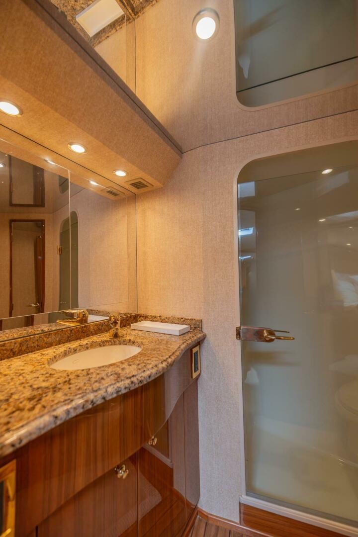a bathroom with a sink and a mirror aboard DON'T STOP BELIEVIN Yacht for Sale