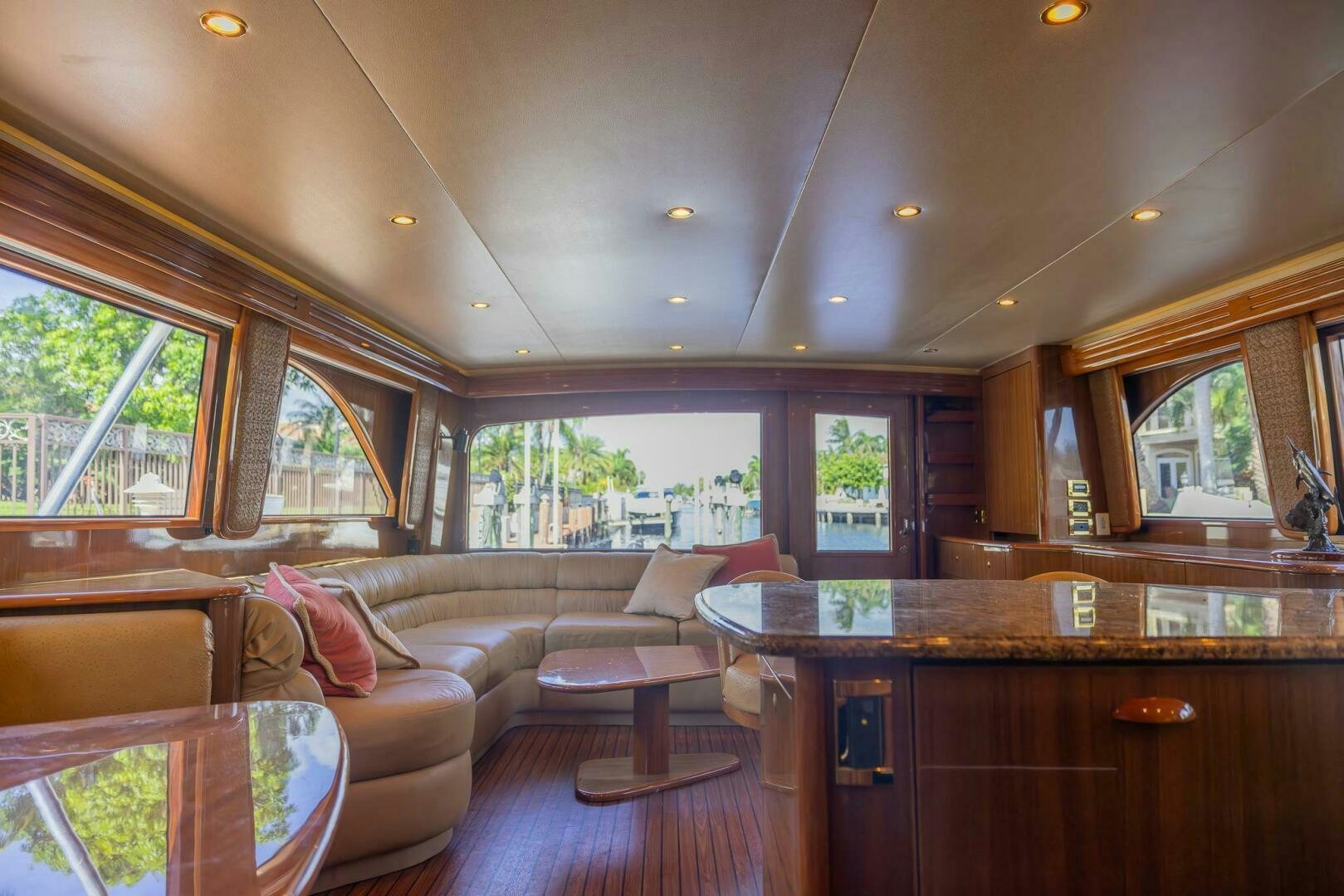 a living room with wood cabinets aboard DON'T STOP BELIEVIN Yacht for Sale