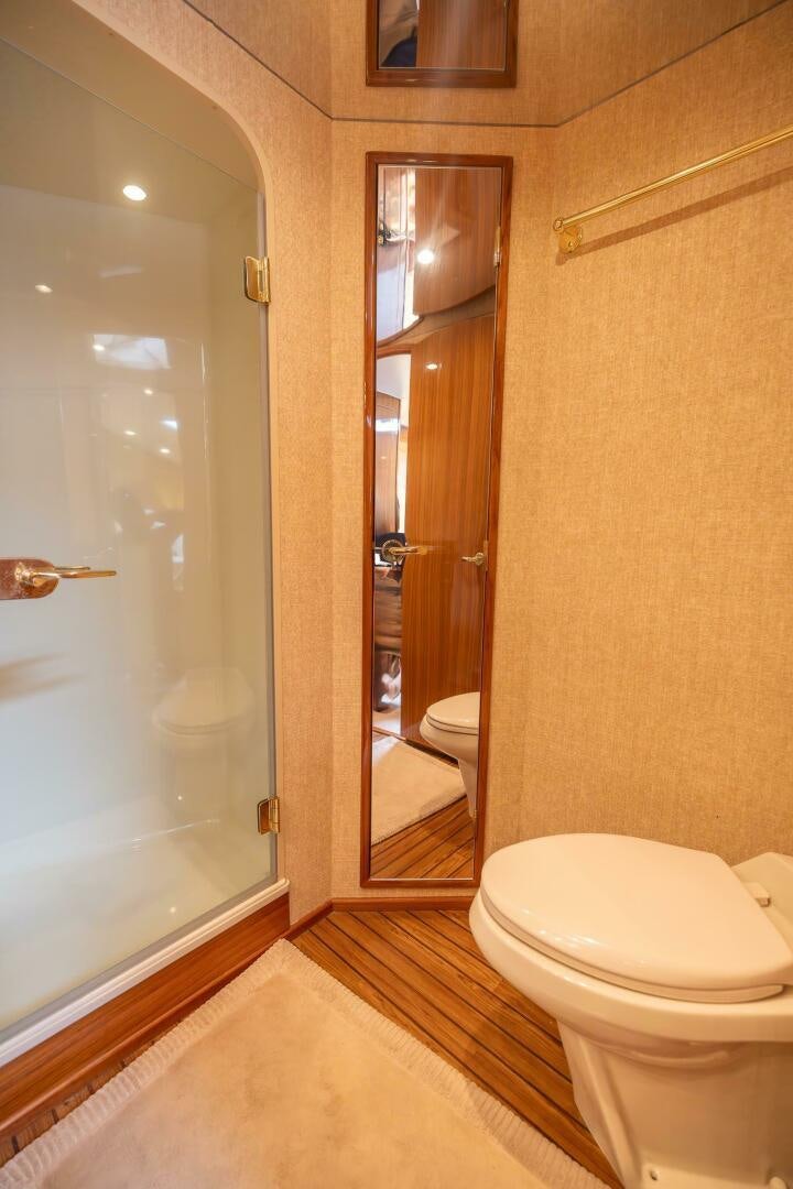 a bathroom with a glass shower door aboard DON'T STOP BELIEVIN Yacht for Sale