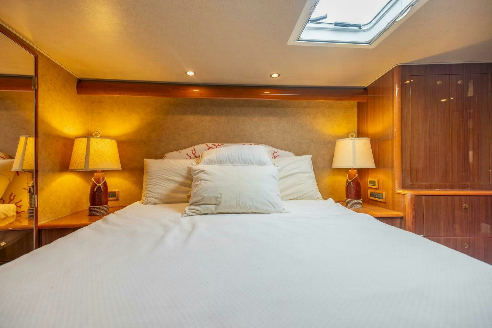 a bed with white sheets aboard DON'T STOP BELIEVIN Yacht for Sale