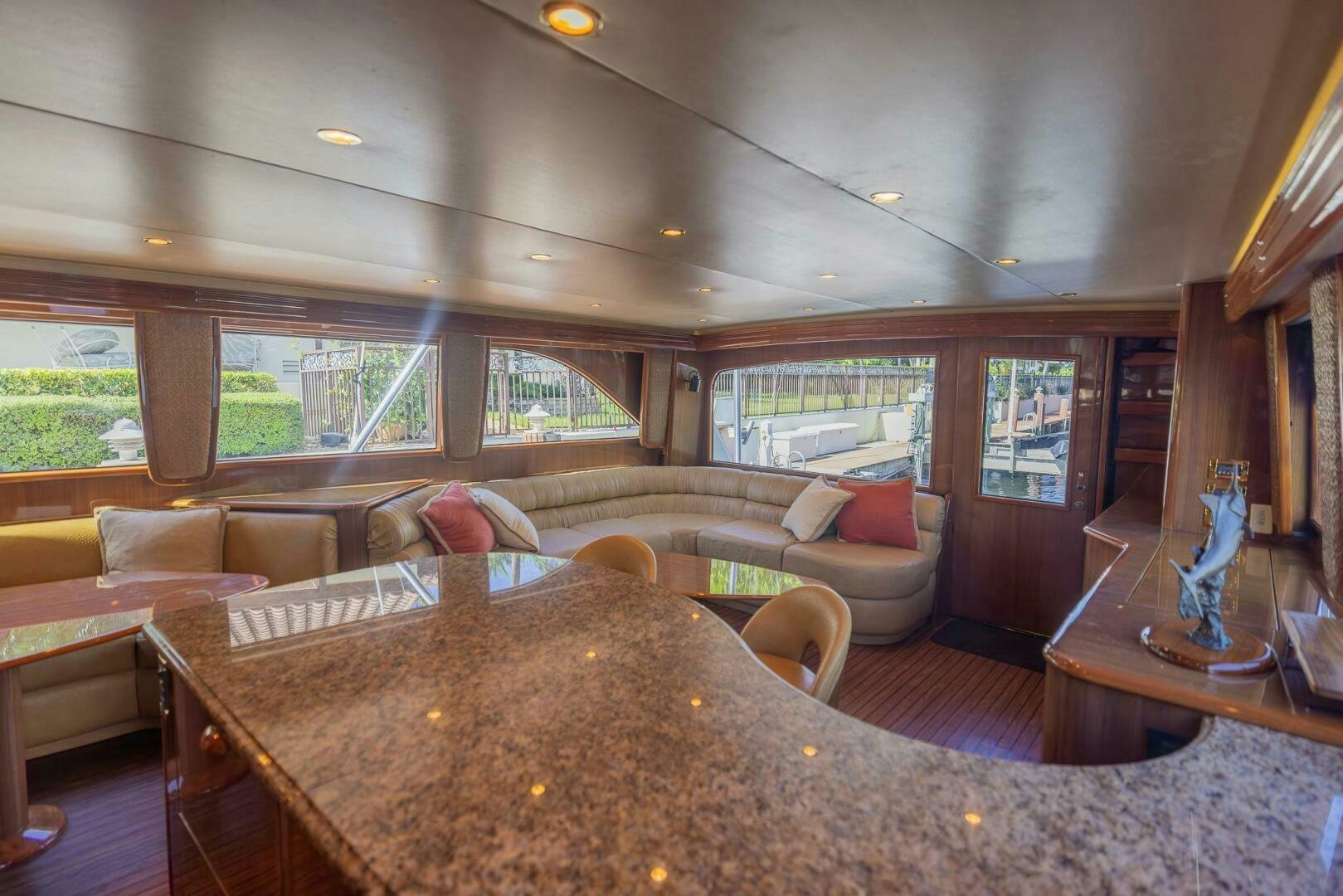 a living room with a large table aboard DON'T STOP BELIEVIN Yacht for Sale