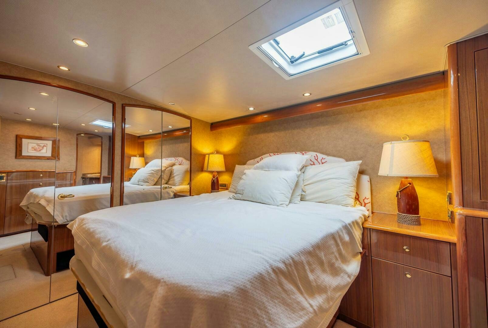 a bedroom with a bed and a desk aboard DON'T STOP BELIEVIN Yacht for Sale