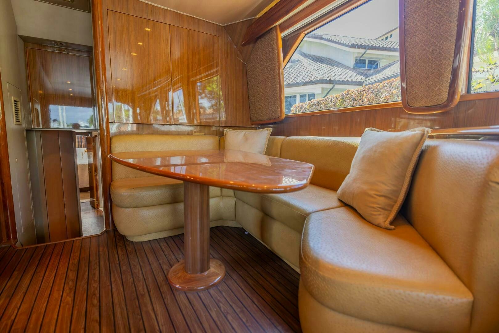 a living room with a table and couches aboard DON'T STOP BELIEVIN Yacht for Sale
