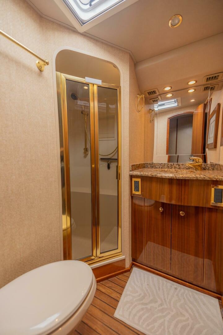 a bathroom with a glass shower aboard DON'T STOP BELIEVIN Yacht for Sale
