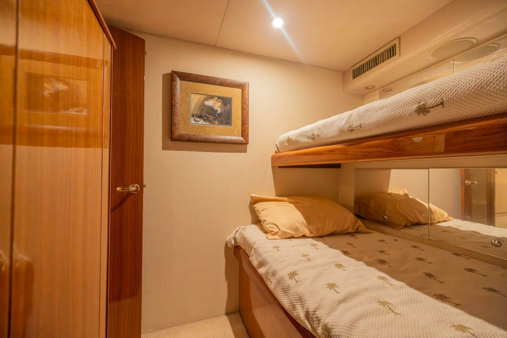 a bedroom with two beds aboard DON'T STOP BELIEVIN Yacht for Sale