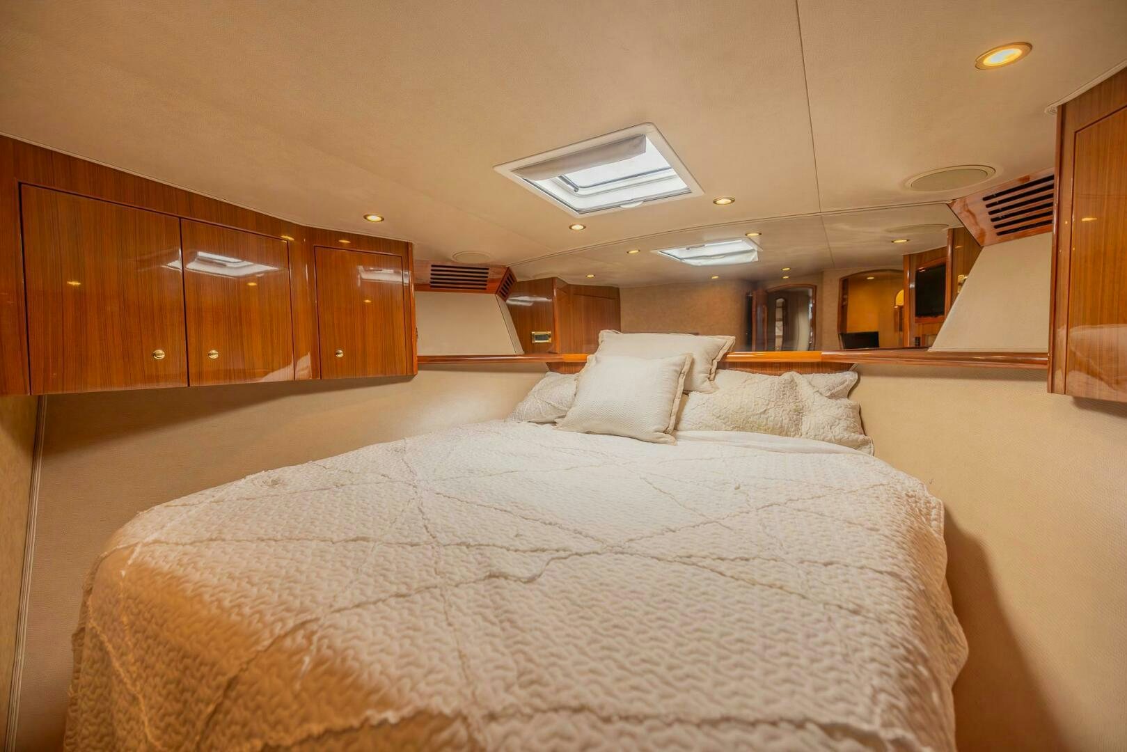 a large bed in a room aboard DON'T STOP BELIEVIN Yacht for Sale