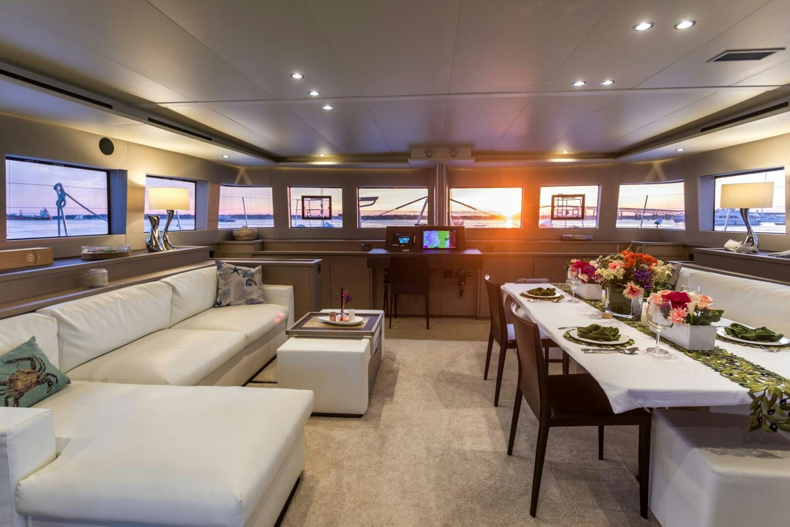 a room with a couch and a table and chairs aboard SECOND WAVE Yacht for Sale