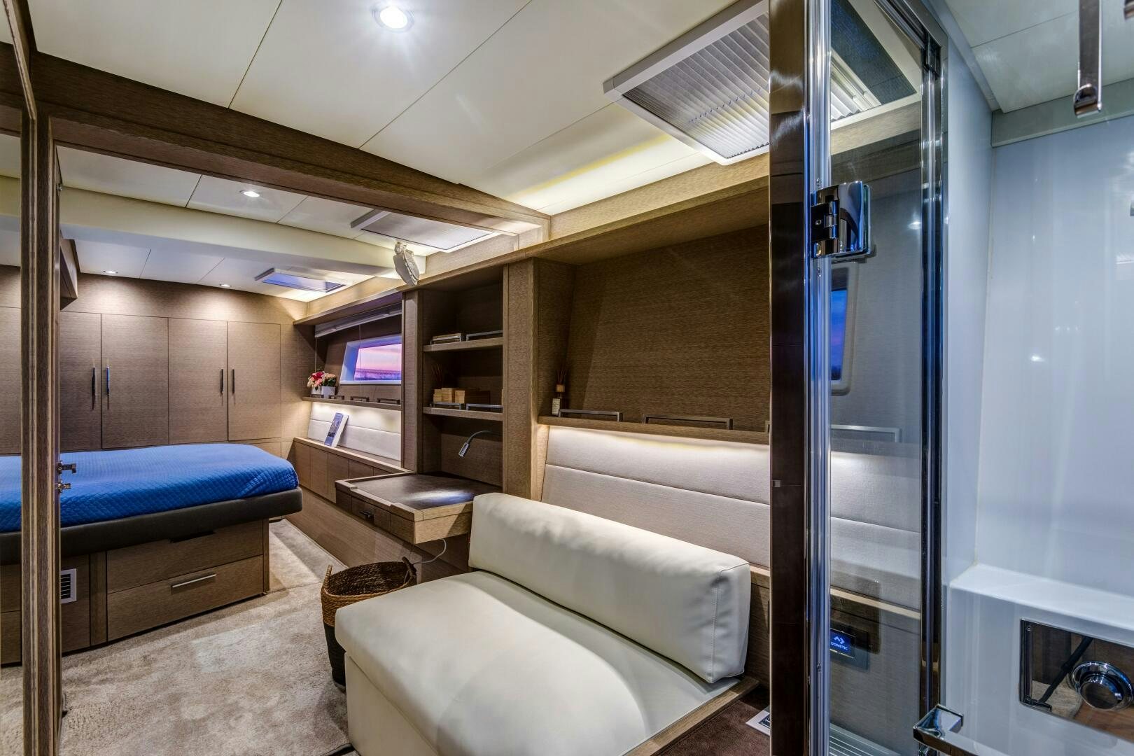 a room with a bed and a desk aboard SECOND WAVE Yacht for Sale