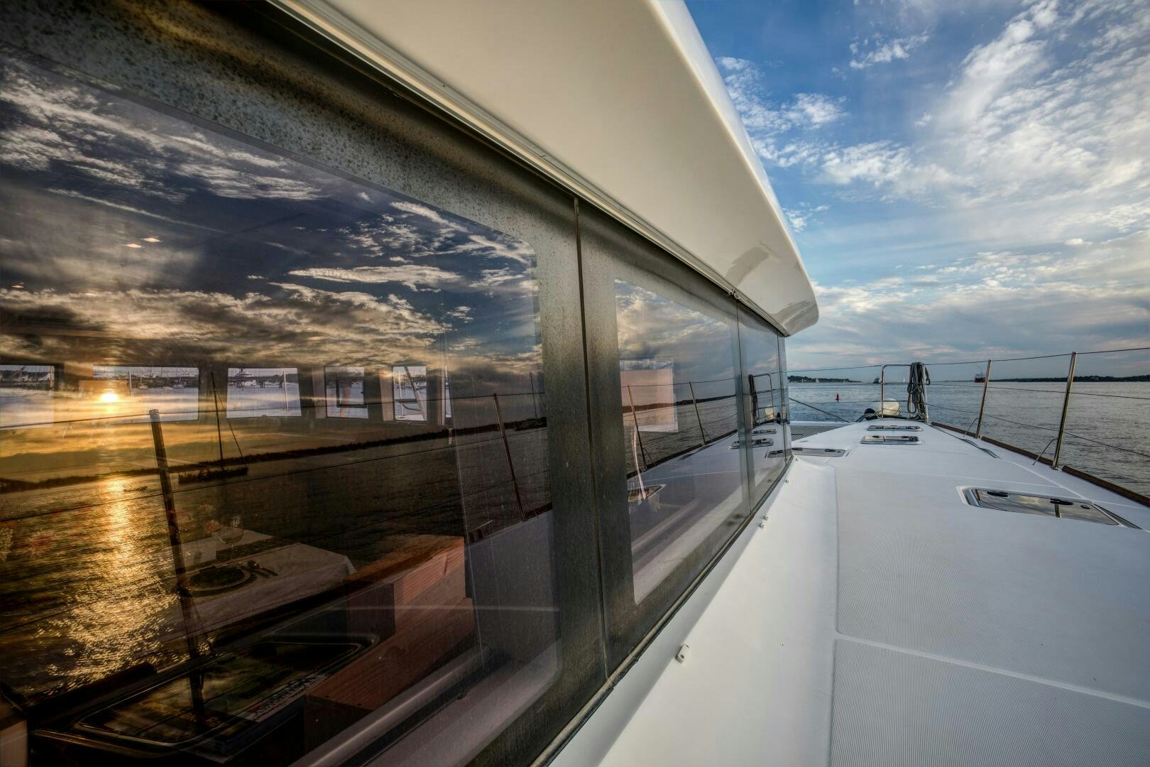 a view of a boat on the water from a window of a boat aboard SECOND WAVE Yacht for Sale