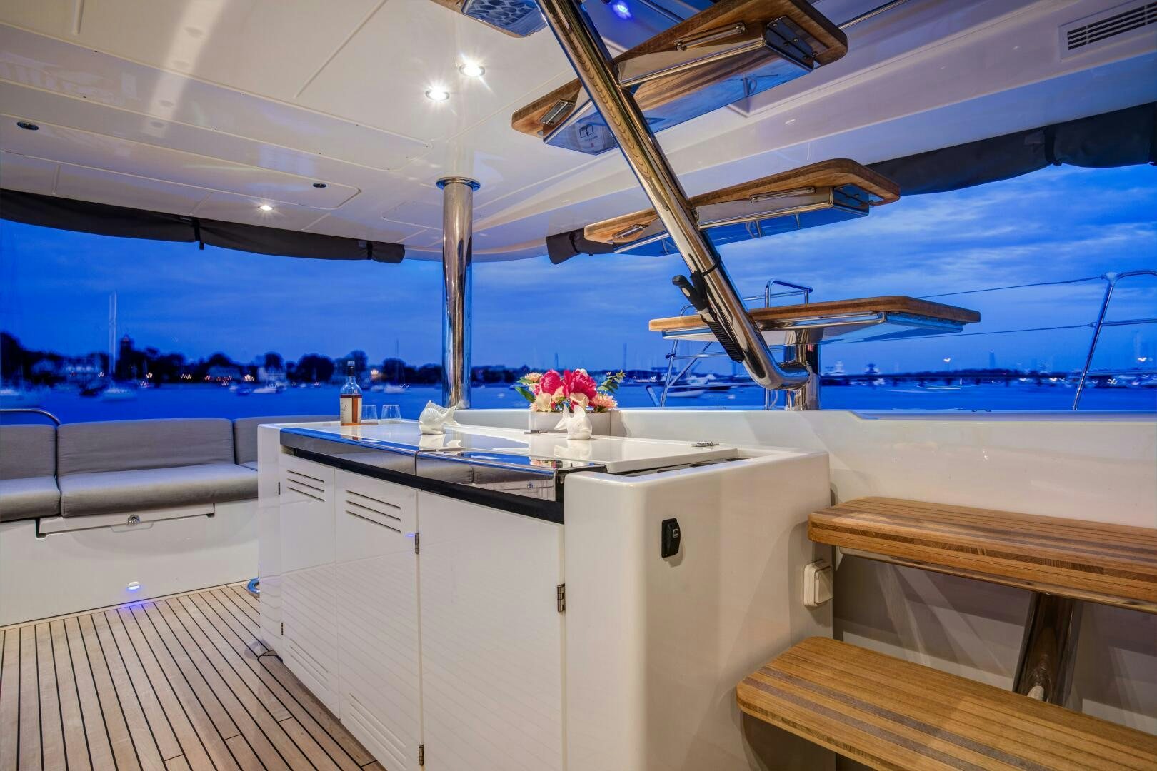 a room with a large white counter and a large window with a view of the ocean aboard SECOND WAVE Yacht for Sale