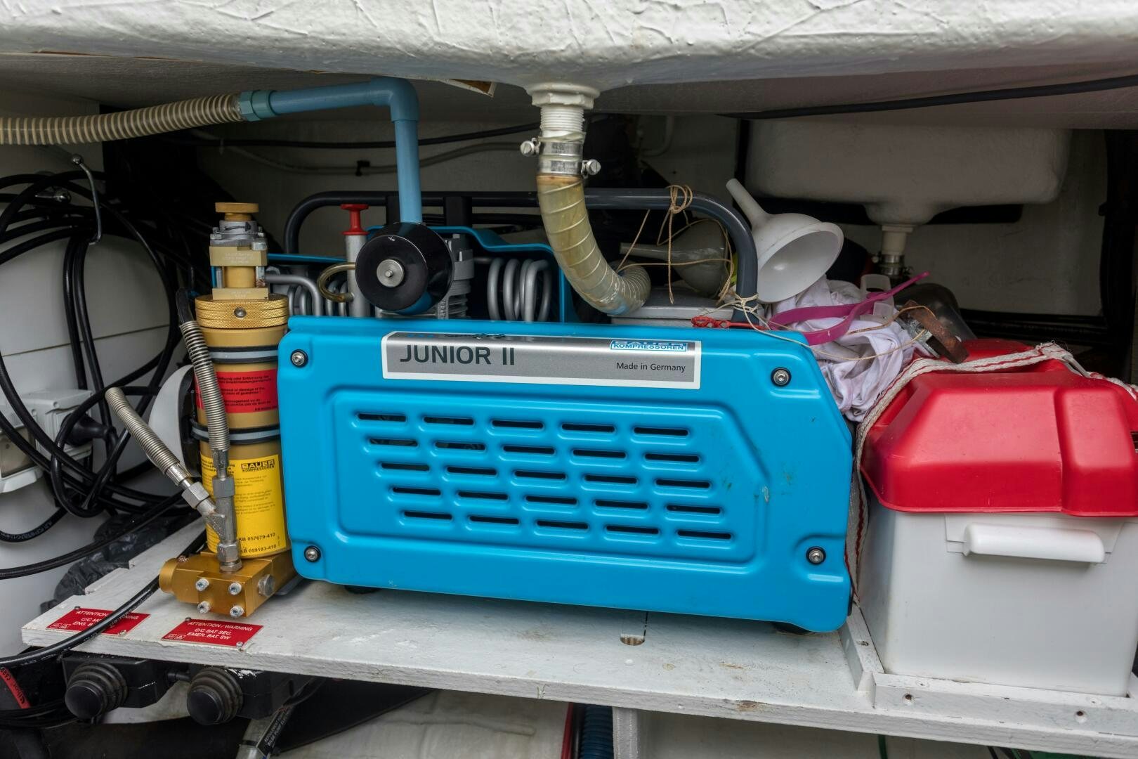 a blue machine with a red tool aboard SECOND WAVE Yacht for Sale