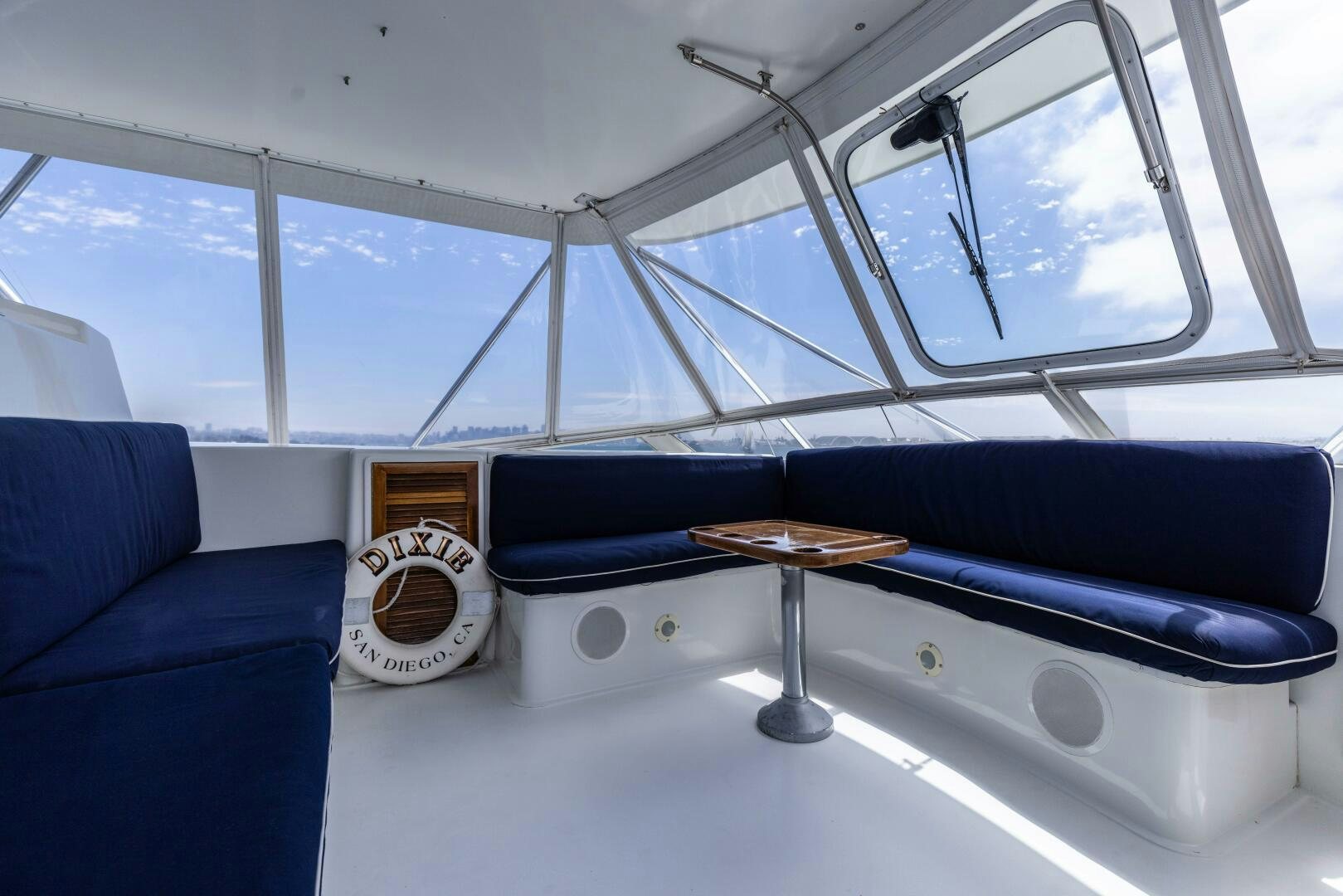 a blue couch and a coffee table aboard DIXIE Yacht for Sale