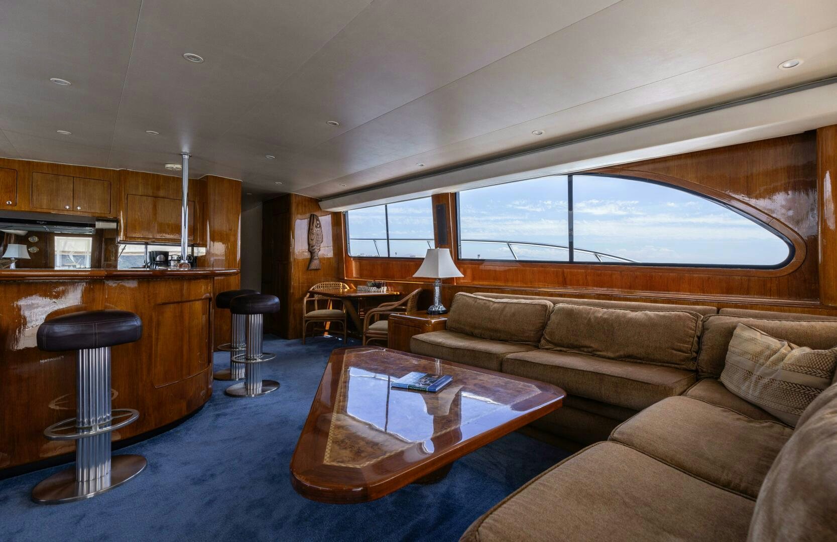 a living room with a couch and a table aboard DIXIE Yacht for Sale