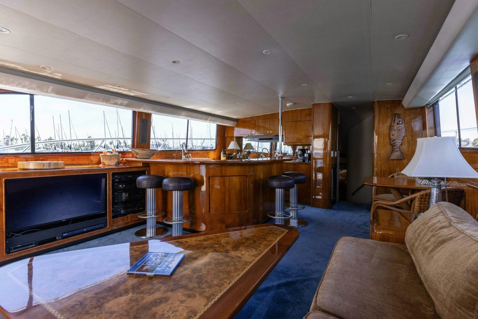 a living room with a large tv aboard DIXIE Yacht for Sale