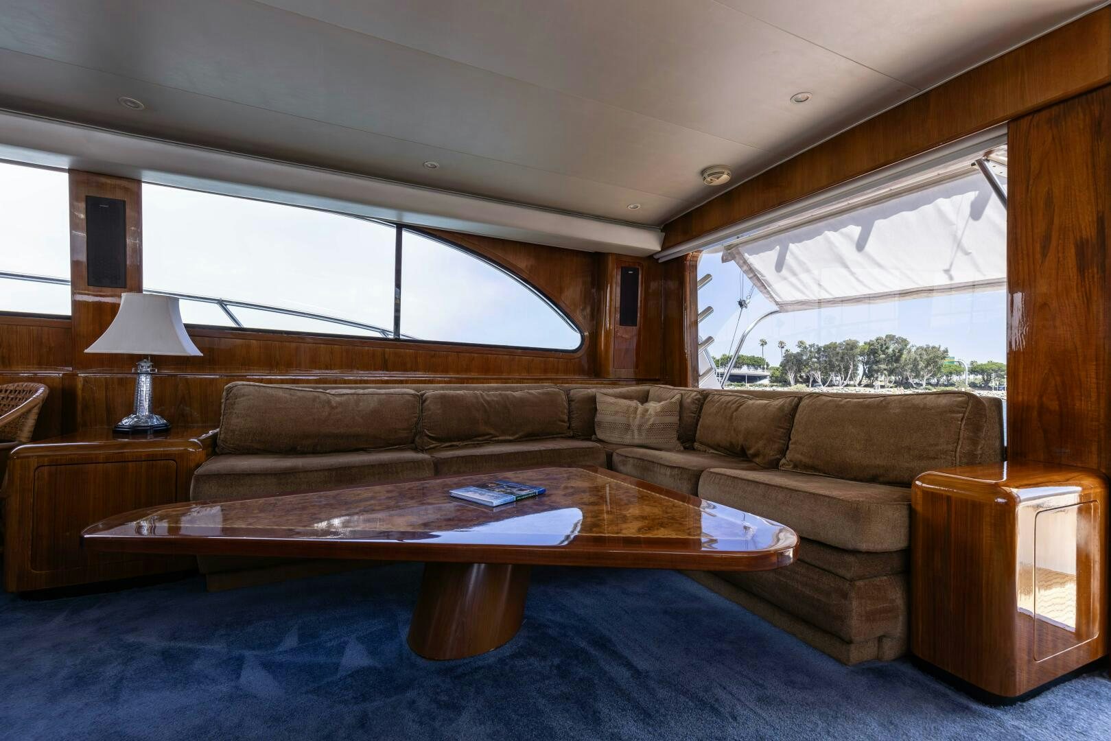 a living room with a couch and a coffee table aboard DIXIE Yacht for Sale