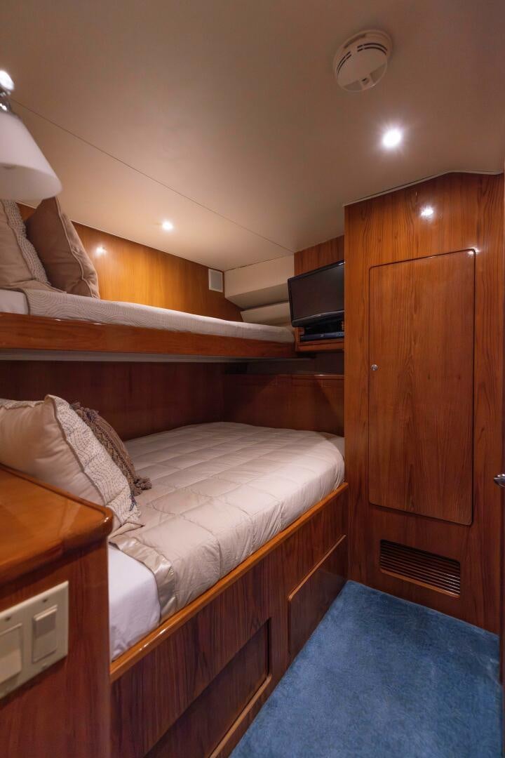 a bed in a room aboard DIXIE Yacht for Sale