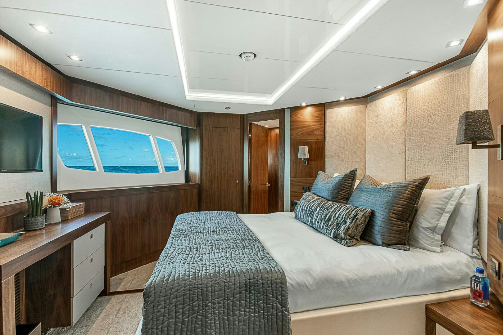 a bed in a room aboard EVEREAST Yacht for Sale
