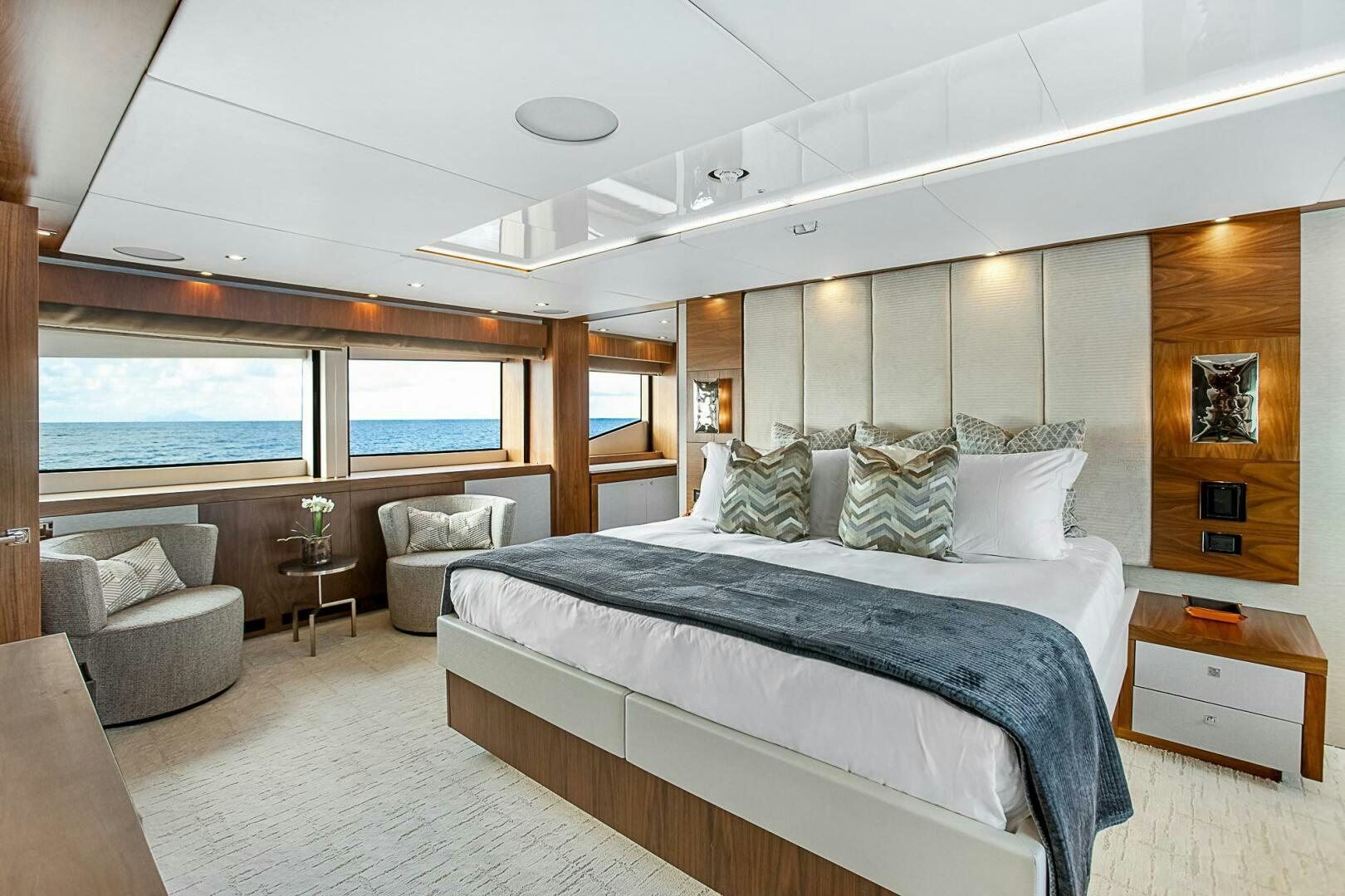a large bed in a room aboard EVEREAST Yacht for Sale