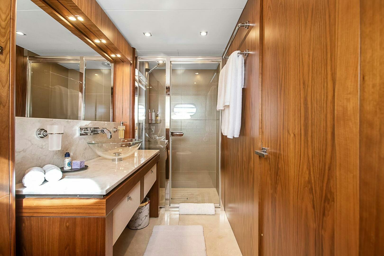 a bathroom with a sink and a mirror aboard EVEREAST Yacht for Sale
