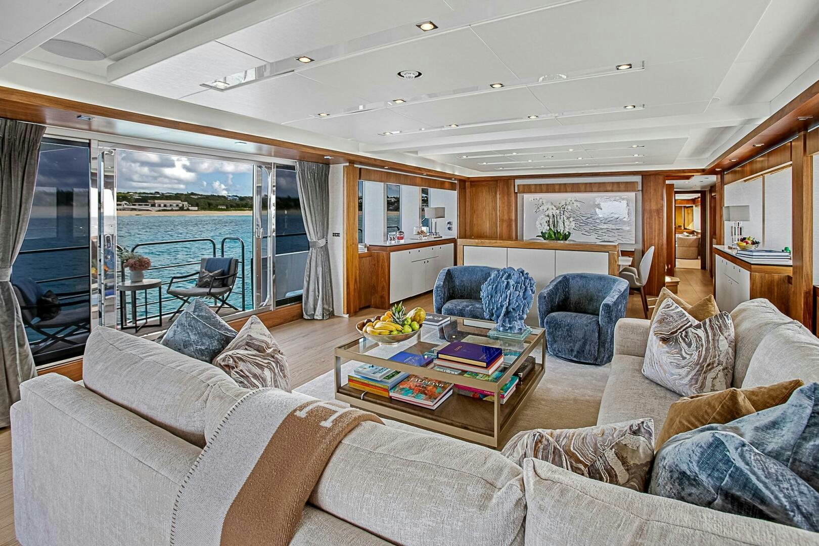a living room with a large glass window aboard EVEREAST Yacht for Sale