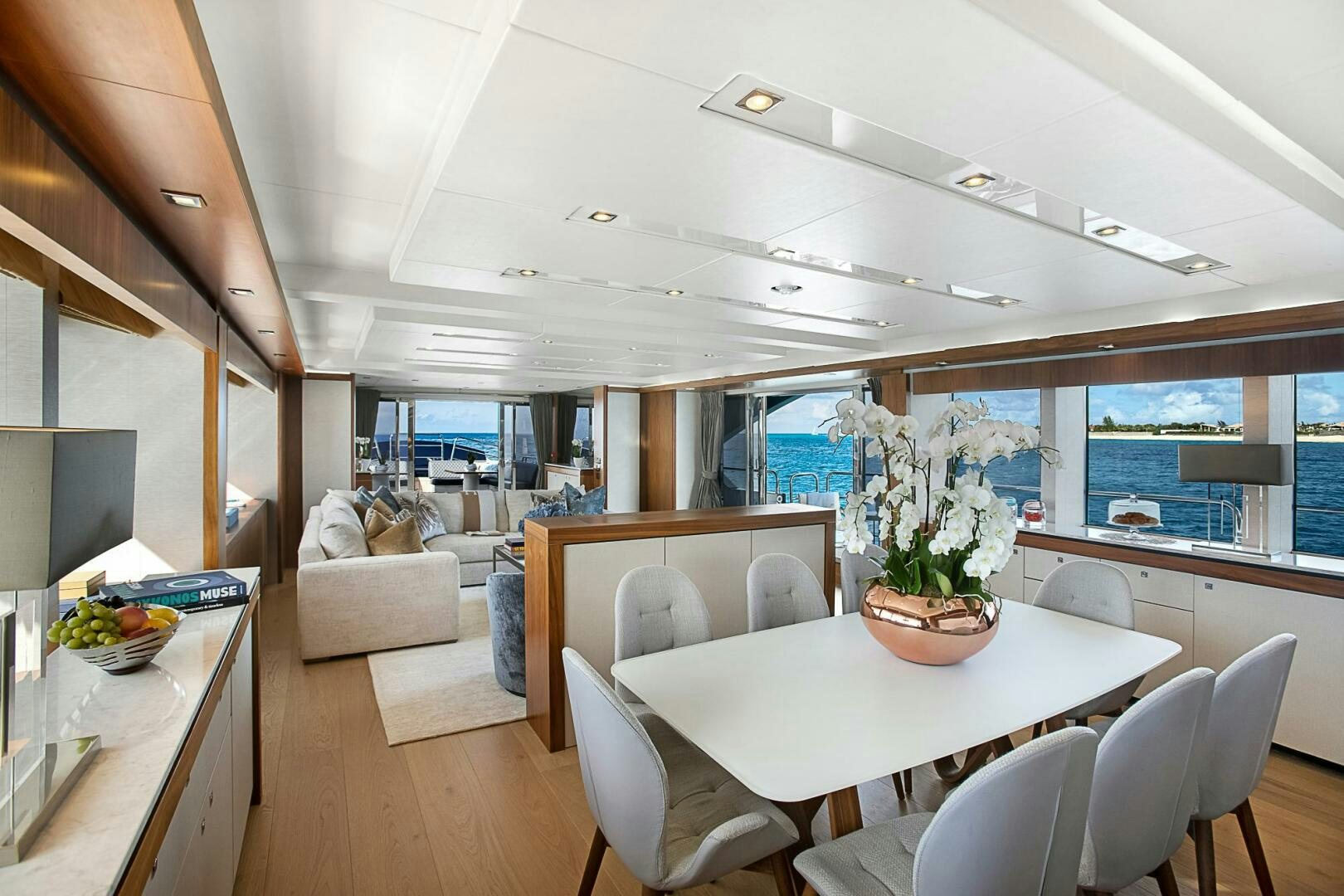 a room with a table and chairs aboard EVEREAST Yacht for Sale