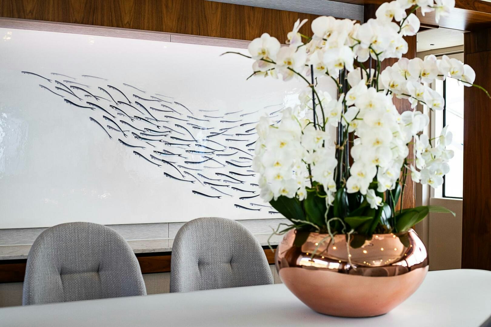 a vase with white flowers aboard EVEREAST Yacht for Sale
