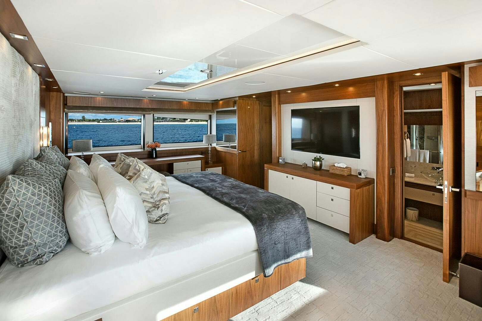 a bedroom with a large bed aboard EVEREAST Yacht for Sale