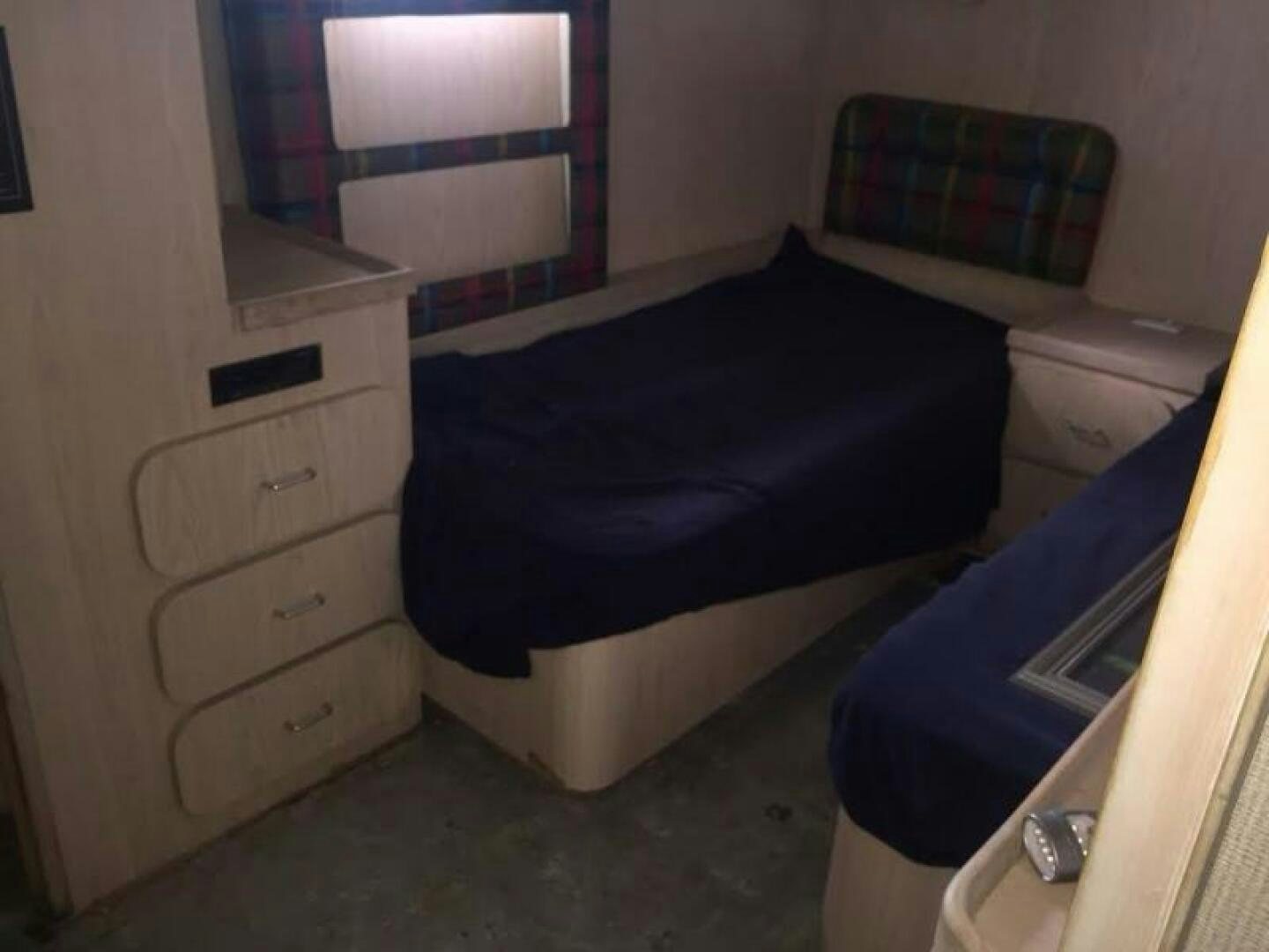 a bed in a room aboard SOUTHERN BREEZE Yacht for Sale