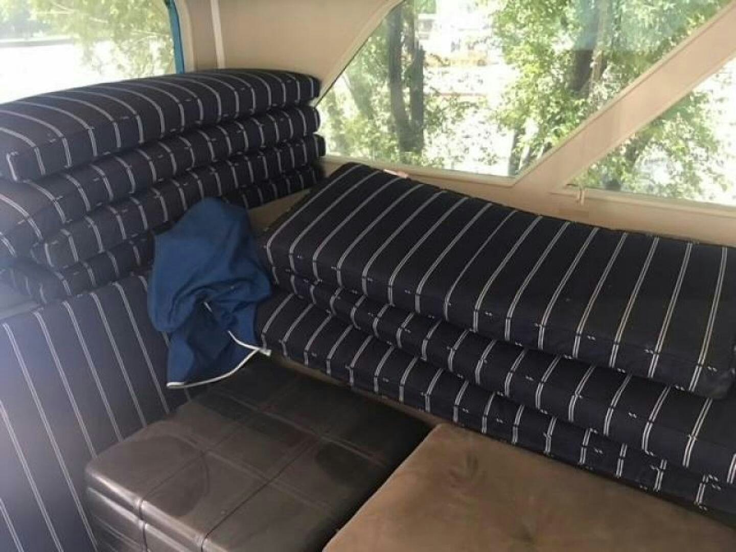 a couch with a pillow on it aboard SOUTHERN BREEZE Yacht for Sale