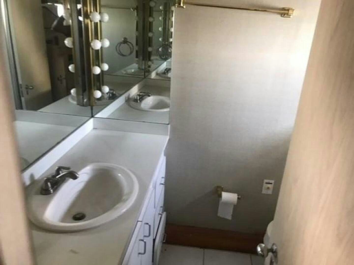 a bathroom with a sink and a mirror aboard SOUTHERN BREEZE Yacht for Sale