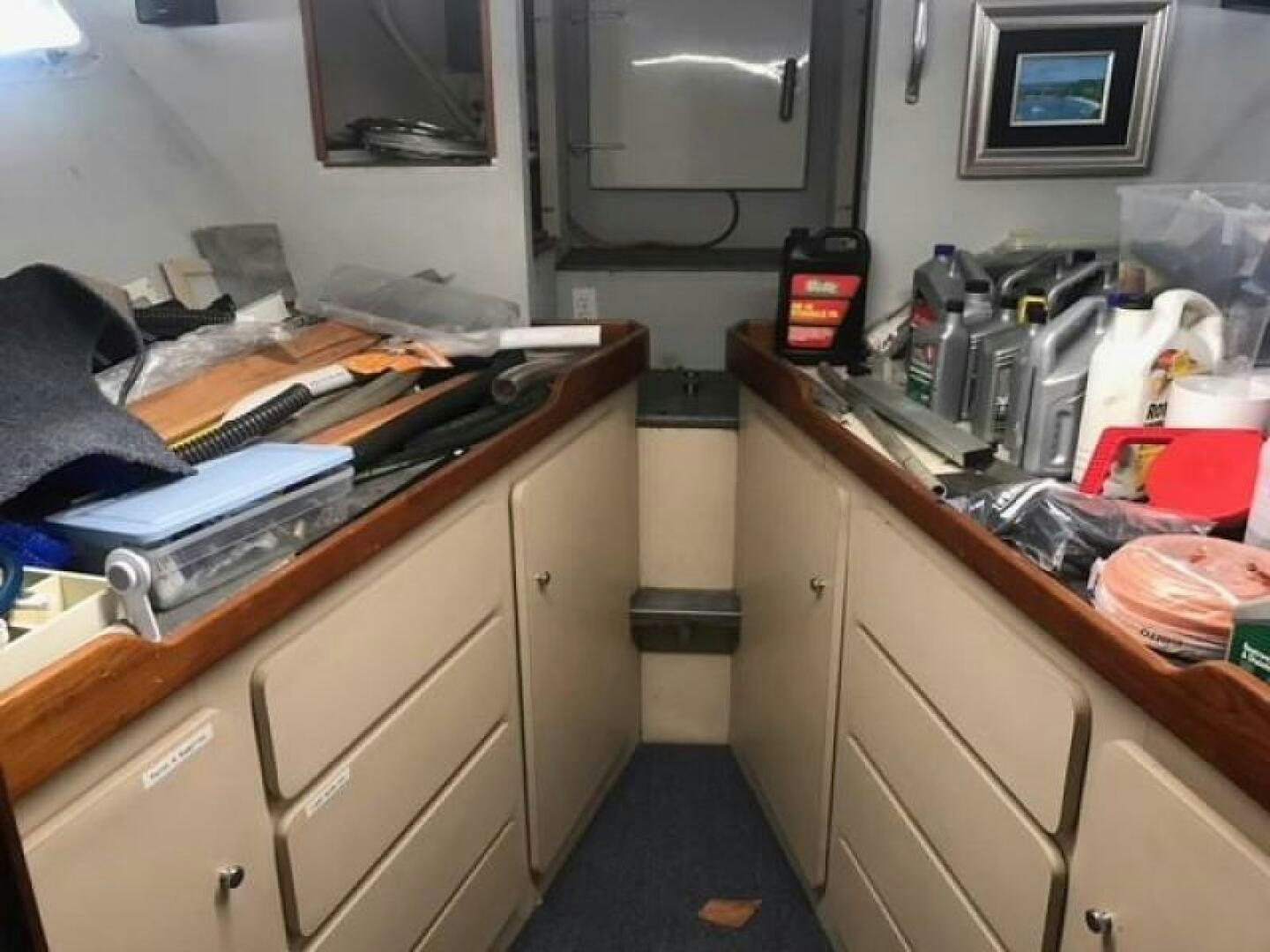 a kitchen with a microwave oven and clutter aboard SOUTHERN BREEZE Yacht for Sale
