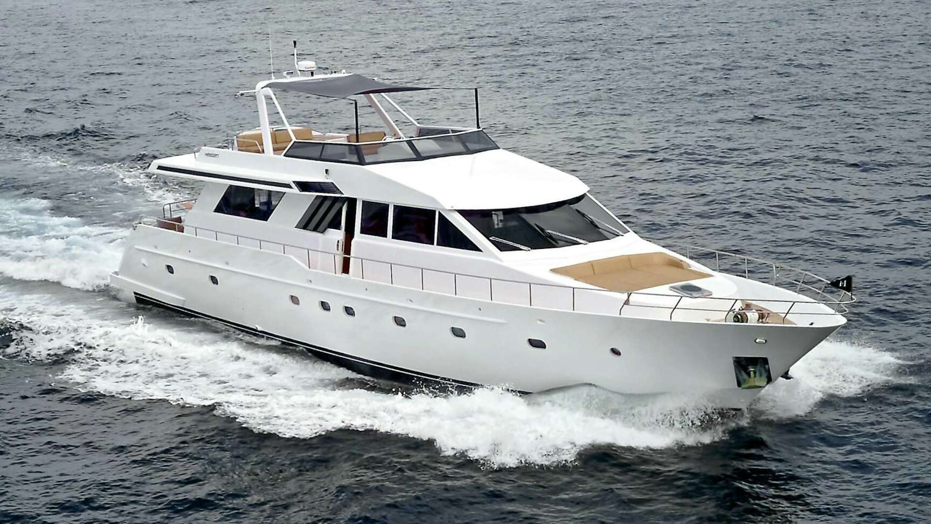 a white yacht on the water aboard LORCA Yacht for Sale