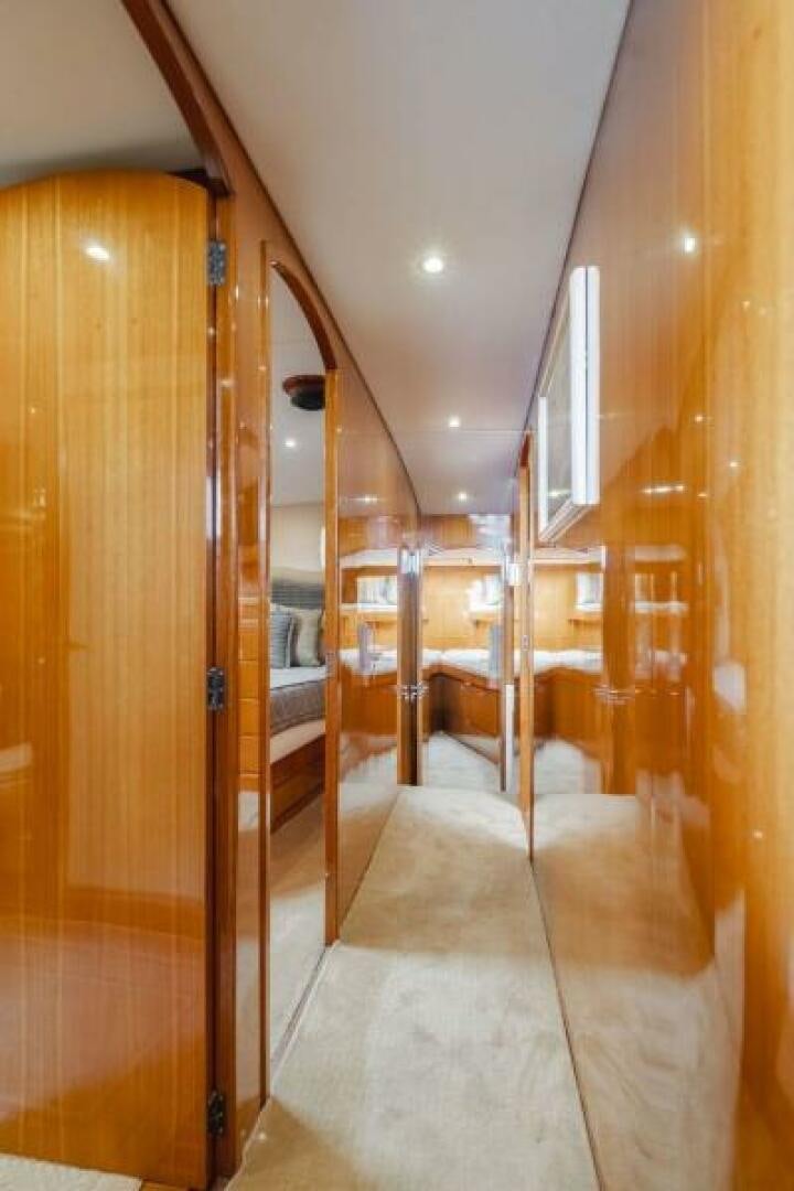 a room with wooden walls and a wood door aboard FAN TAIL I Yacht for Sale