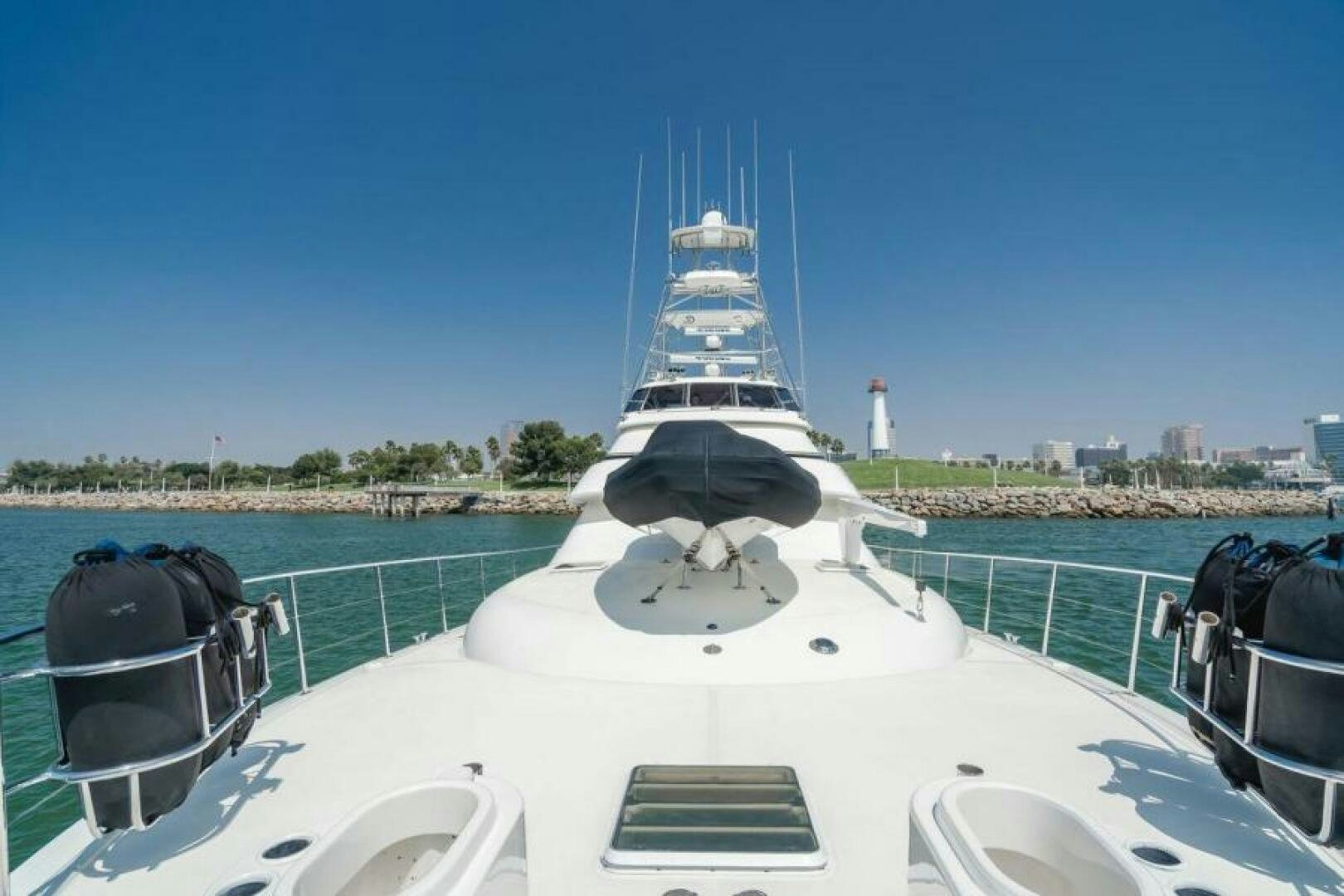 a white boat with a black and white sail on a body of water aboard FAN TAIL I Yacht for Sale