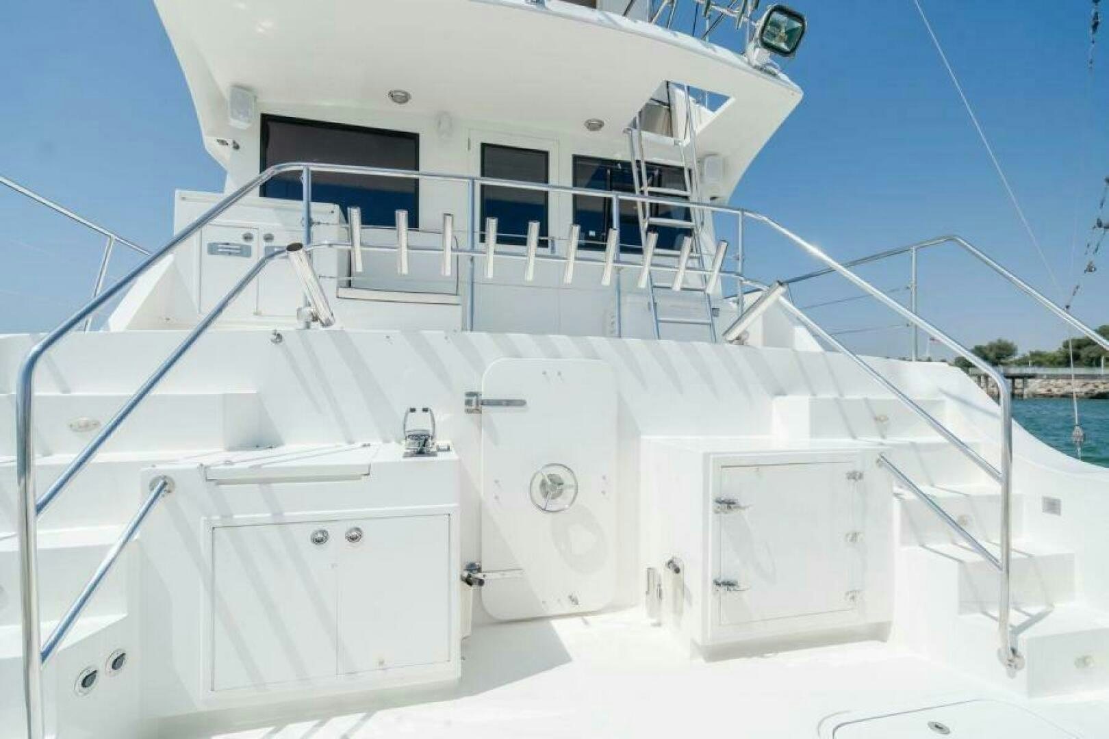 a white boat with a white roof aboard FAN TAIL I Yacht for Sale