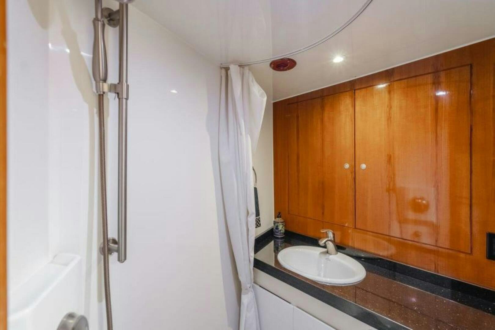 a bathroom with a sink and a shower aboard FAN TAIL I Yacht for Sale