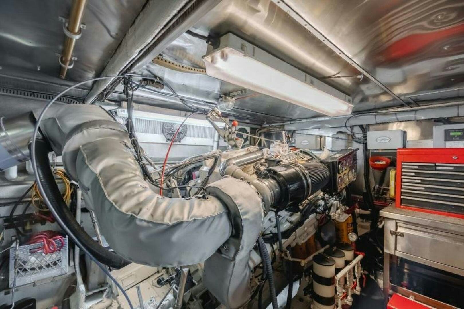 a car engine with a large hood aboard FAN TAIL I Yacht for Sale