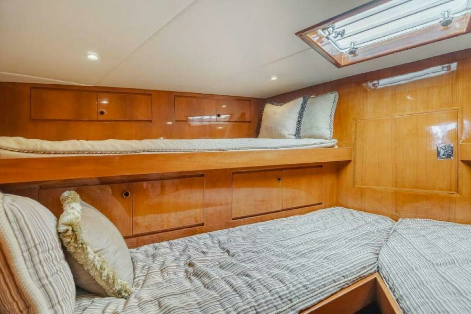 a bed with white sheets aboard FAN TAIL I Yacht for Sale