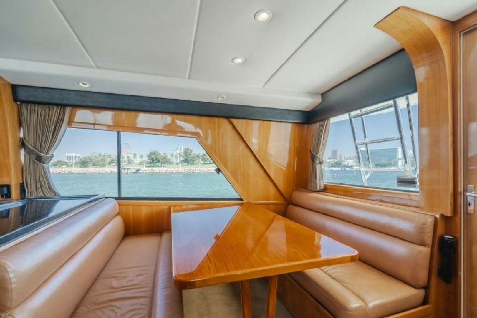 a room with a table and chairs aboard FAN TAIL I Yacht for Sale