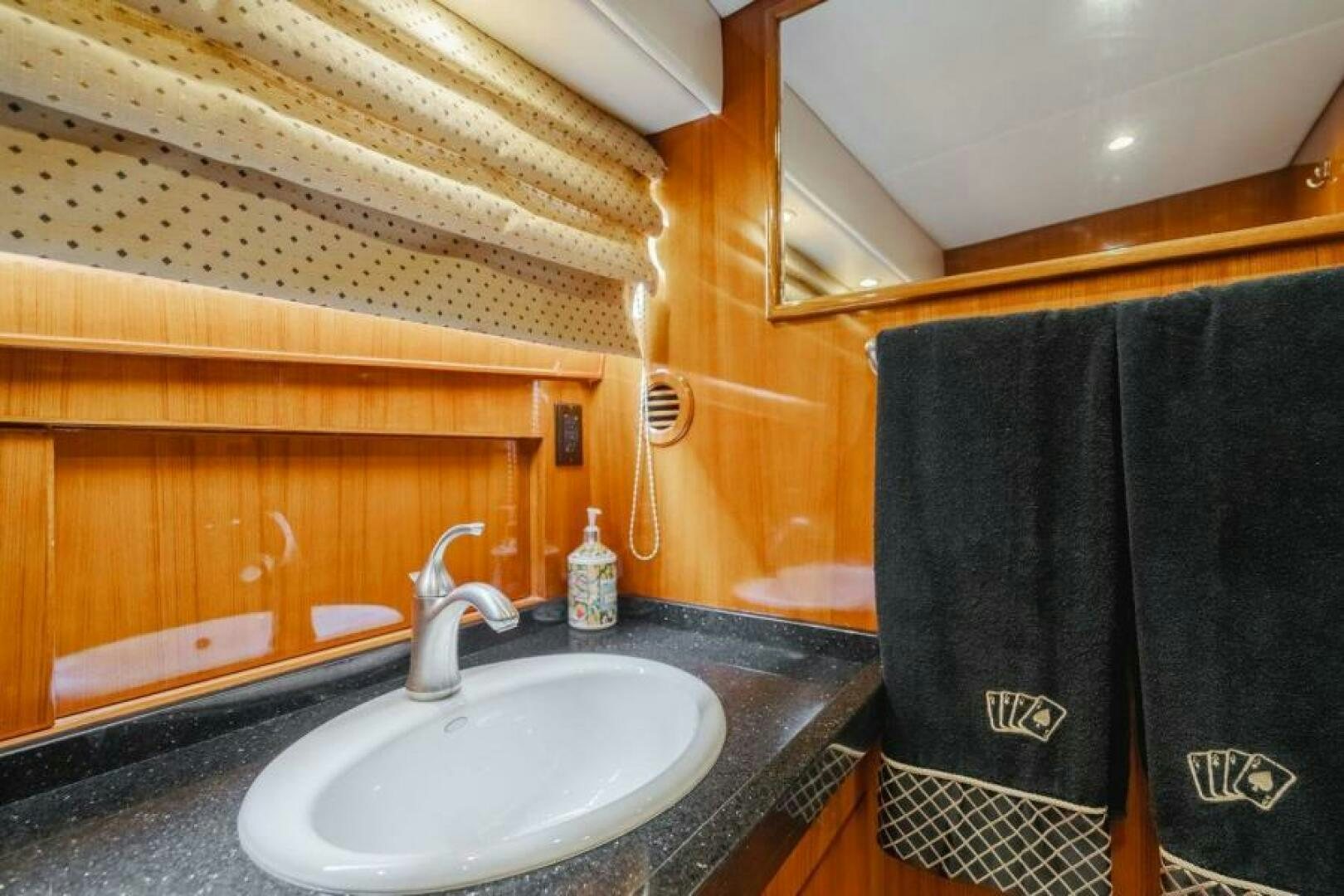 a bathroom with a sink and a towel on the wall aboard FAN TAIL I Yacht for Sale