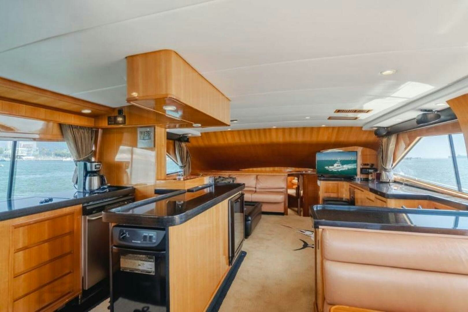 a kitchen with a stove and a microwave aboard FAN TAIL I Yacht for Sale