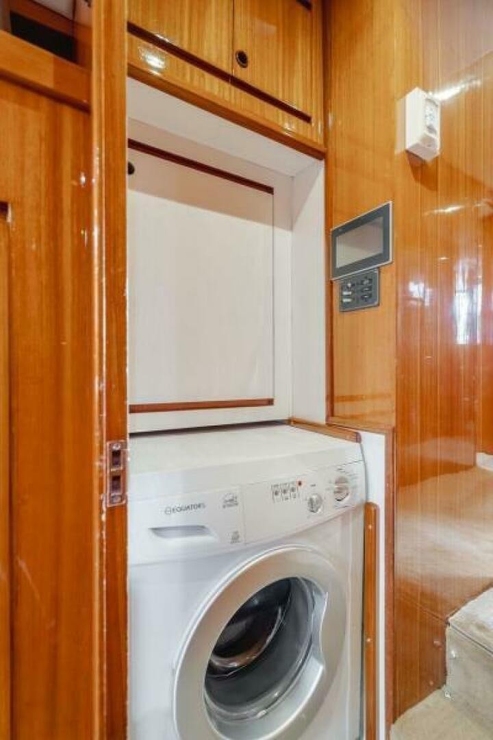 a washer and dryer in a closet aboard FAN TAIL I Yacht for Sale