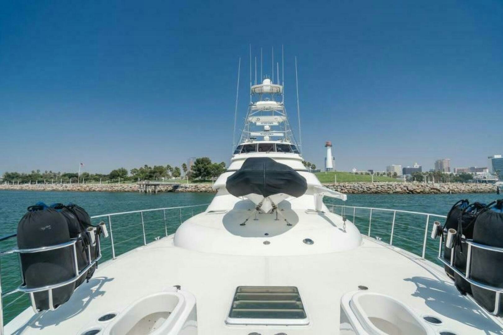 a white boat with a black and white sail on a body of water aboard FAN TAIL I Yacht for Sale
