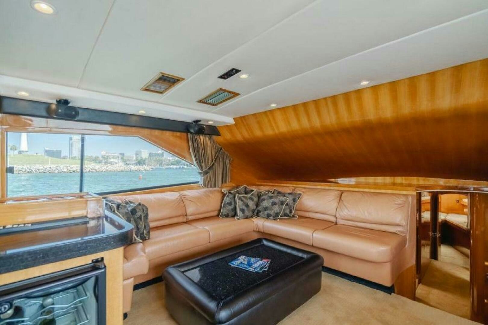 a living room with a couch and a fireplace aboard FAN TAIL I Yacht for Sale