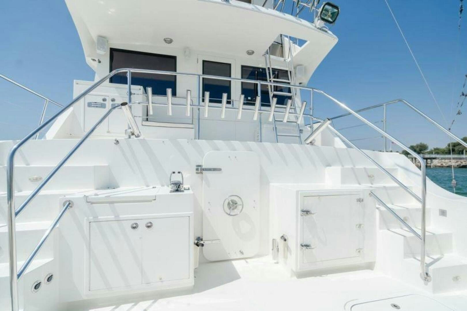 a white boat with a white roof aboard FAN TAIL I Yacht for Sale