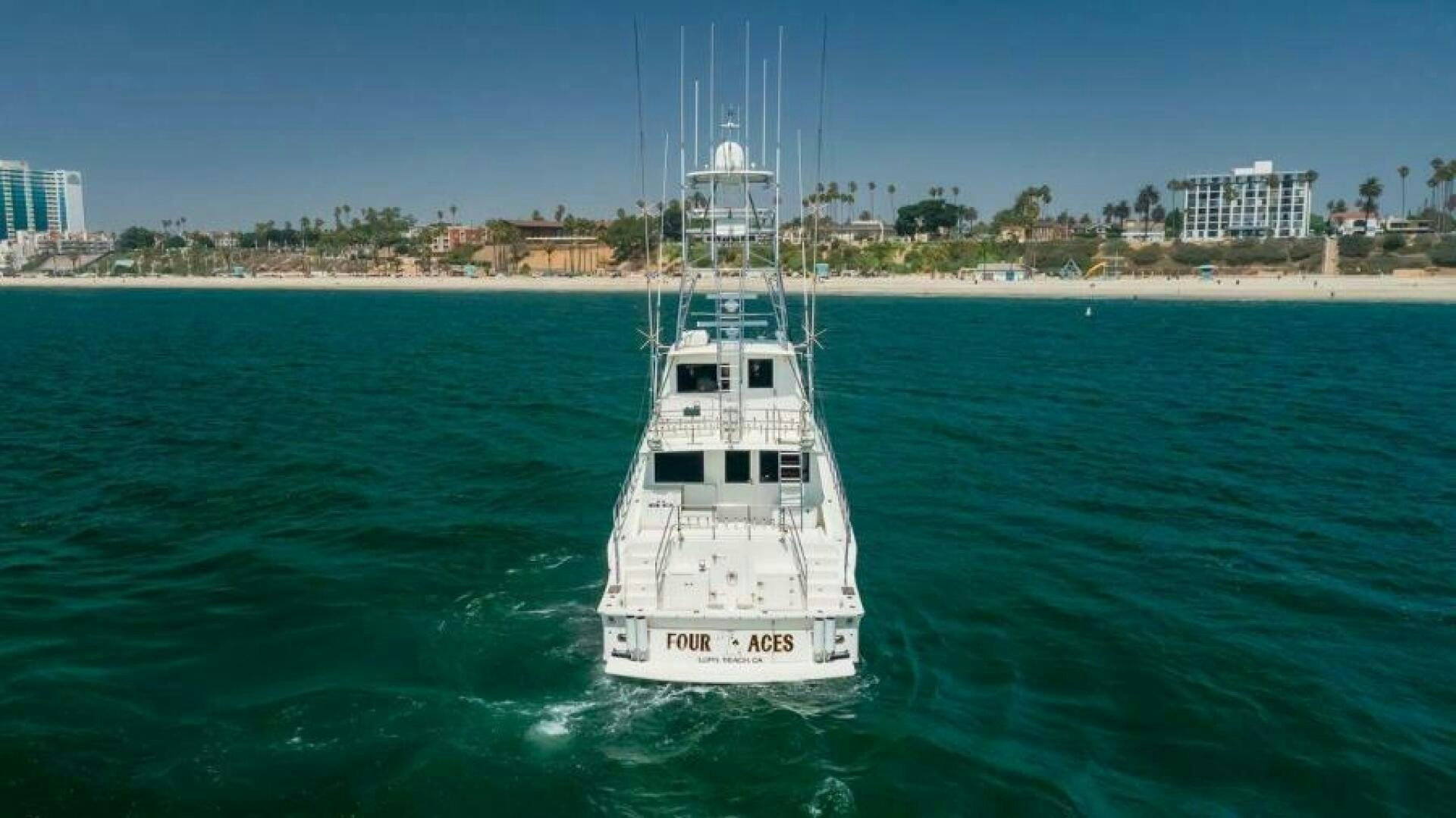a white boat in the water aboard FAN TAIL I Yacht for Sale