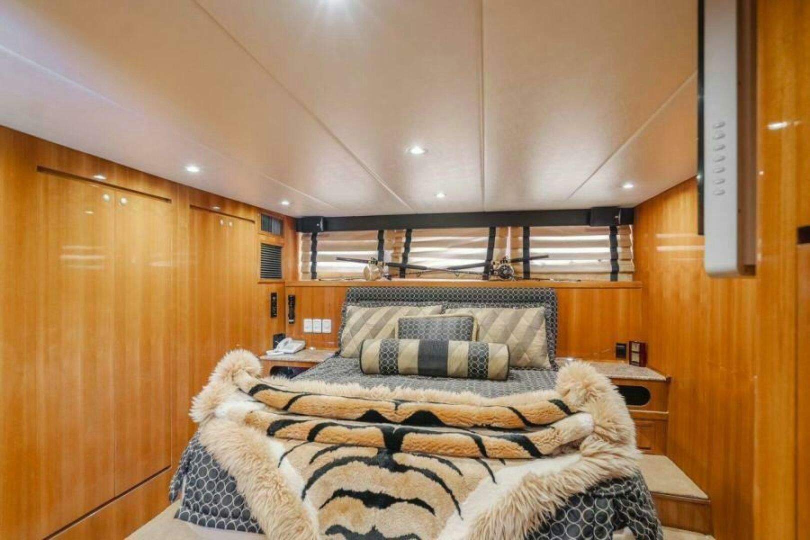 a bed with a blanket aboard FAN TAIL I Yacht for Sale