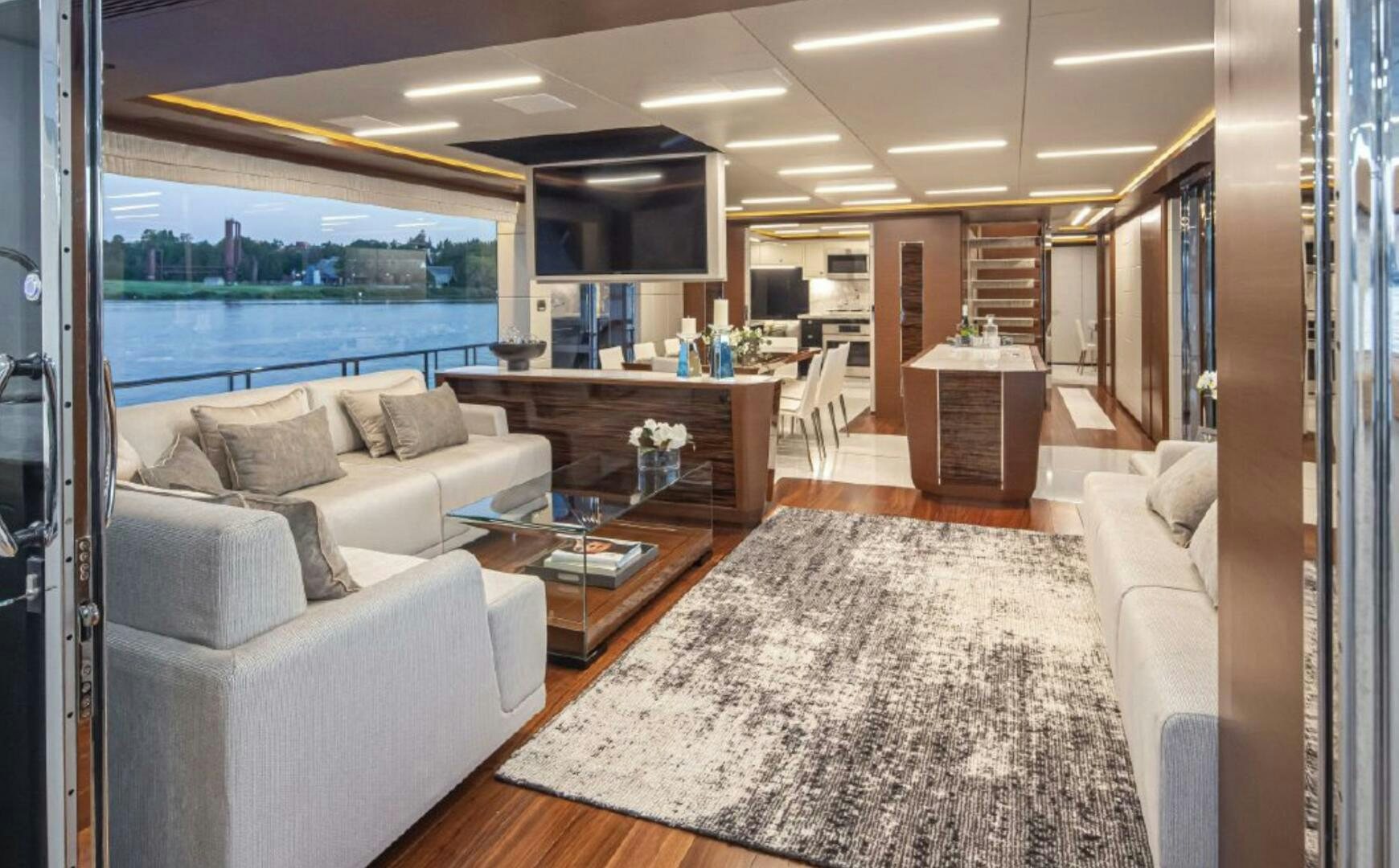a living room with a large window aboard TLC Yacht for Sale