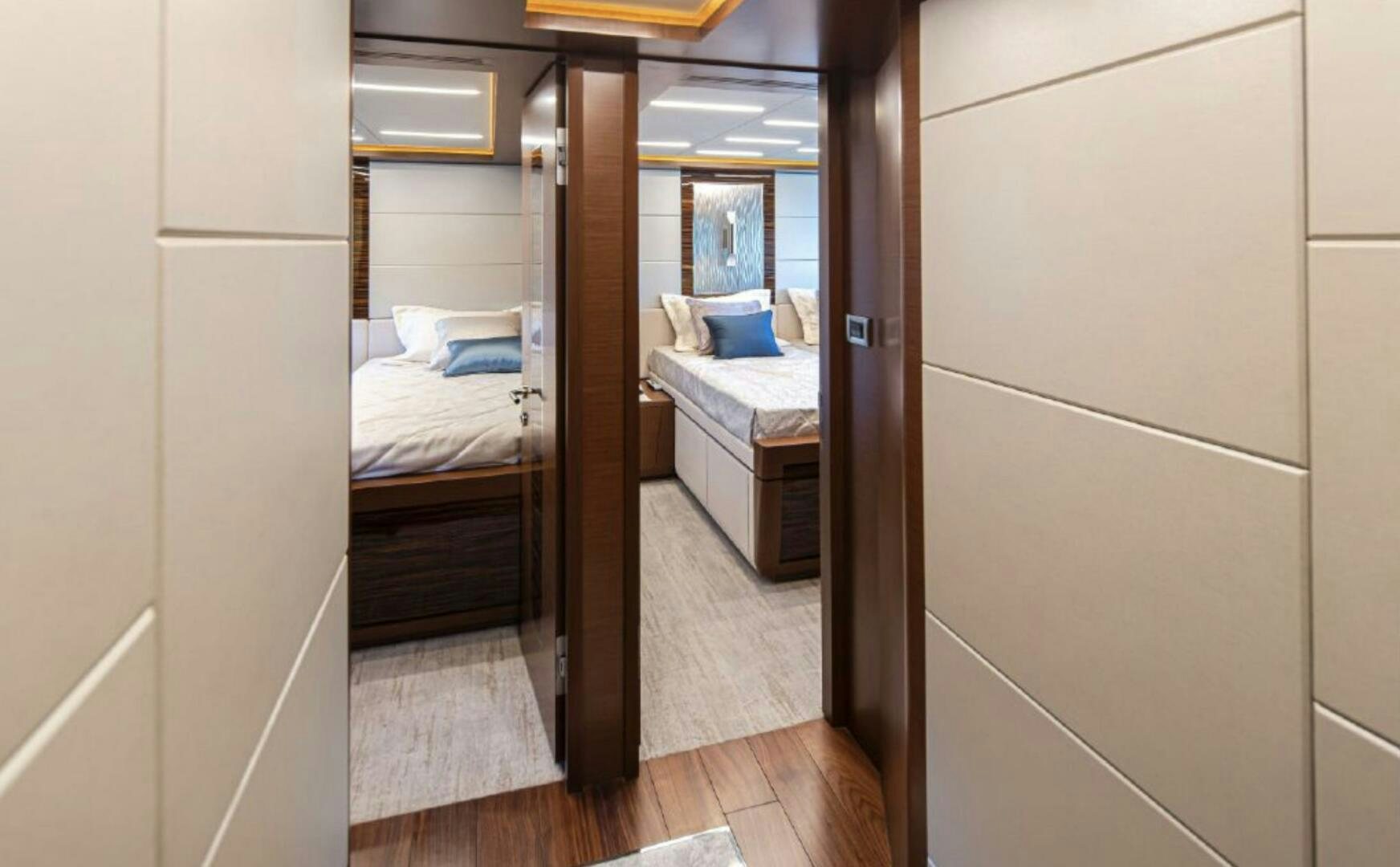 a room with a bed and a mirror aboard TLC Yacht for Sale